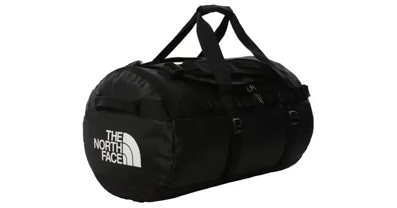 Schwarze Reisetasche The North Face Base Camp Duffel in Größe M mit Tragegriffen, Produktfoto auf weißem Grund